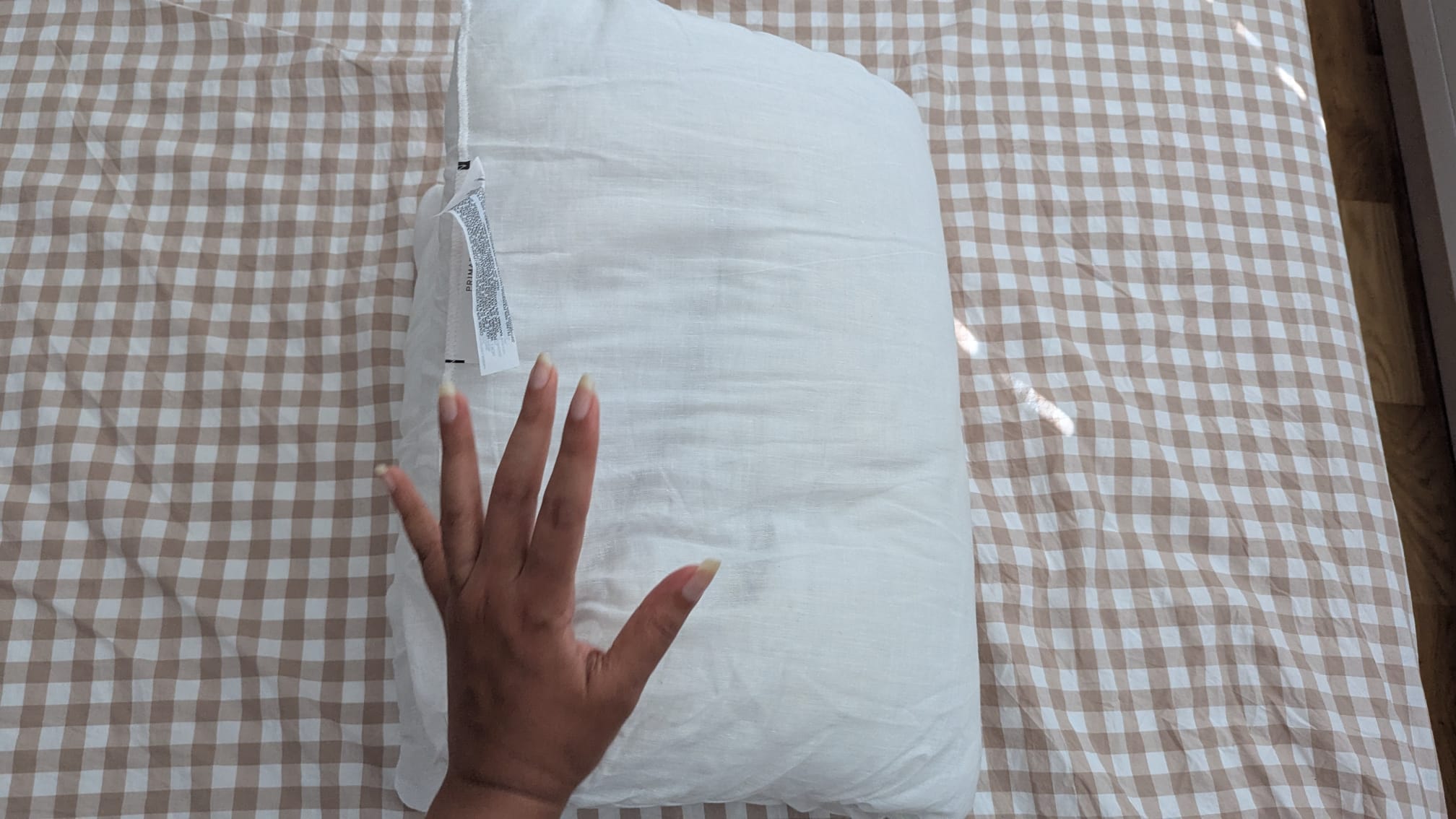 Folding a pillow in half to check its support