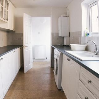kitchen with white cabinets and sink