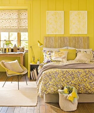 bedroom with yellow wall and framed wallpaper on wall