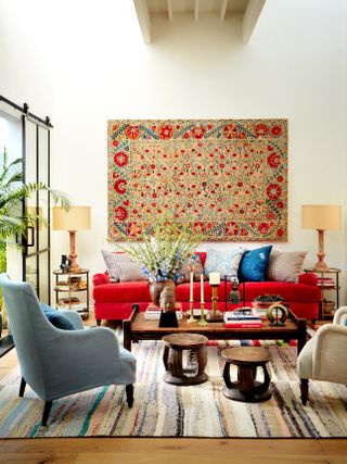 Living room with tapestry on the wall