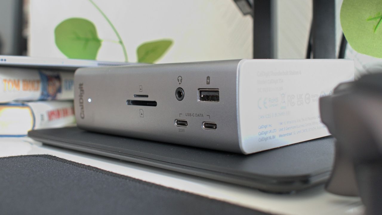 Wide image of the CalDigit Thunderbolt Station 4 on a desk showing its front ports in horizontal orientation.