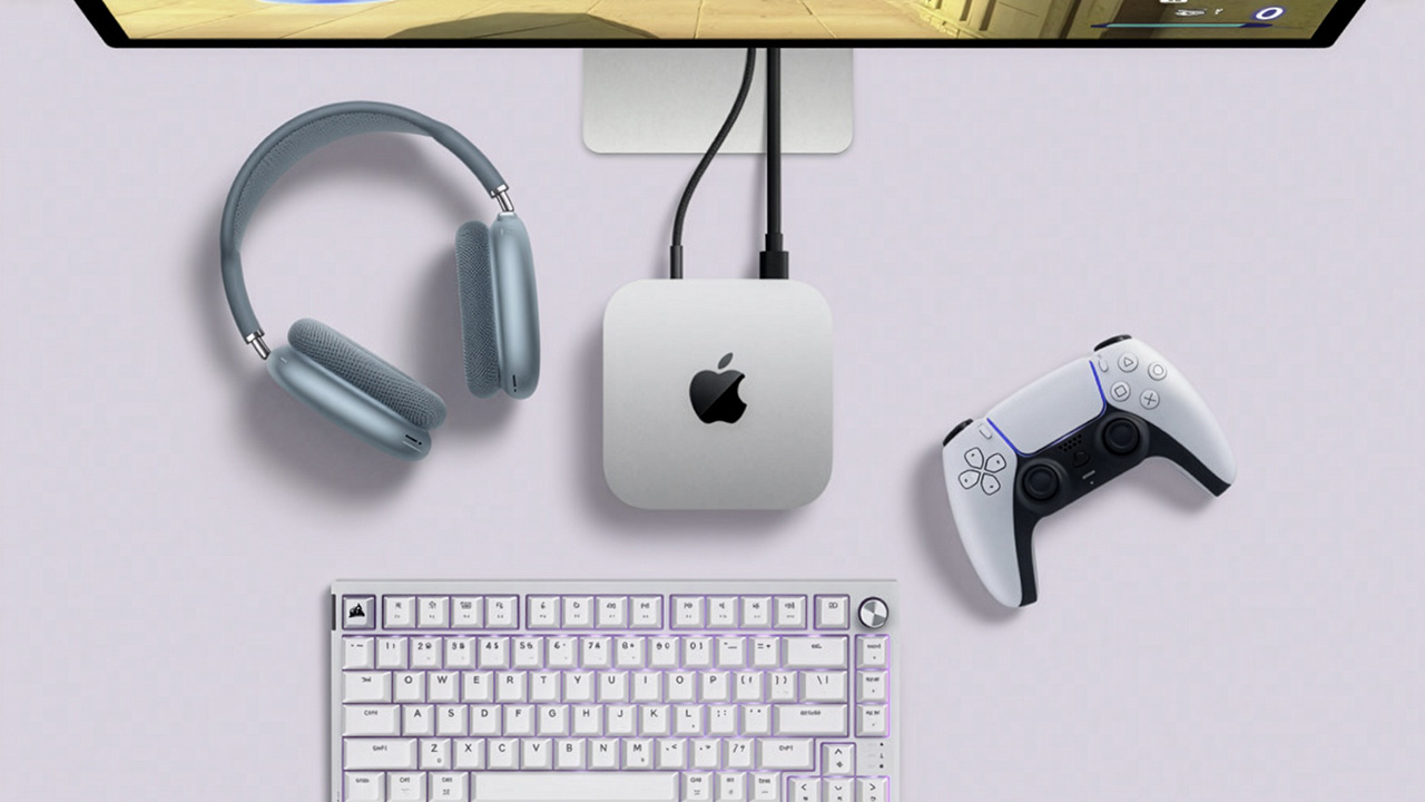 Apple Mac mini M4 on purple background with gaming accessories