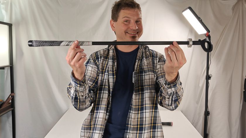 Holding the AMVR haptic feedback golf club accessory for the Meta Quest 3 and 3S