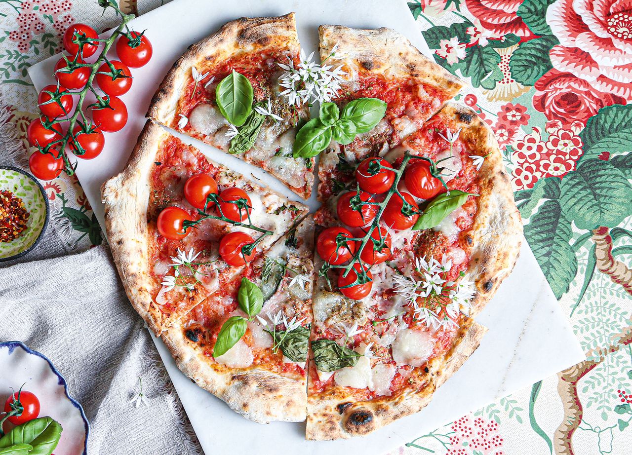 A classic Italian pizza ready to be sliced.