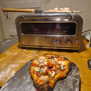 A cooked pizza fresh out of the Breville Smart Oven Pizzaiolo