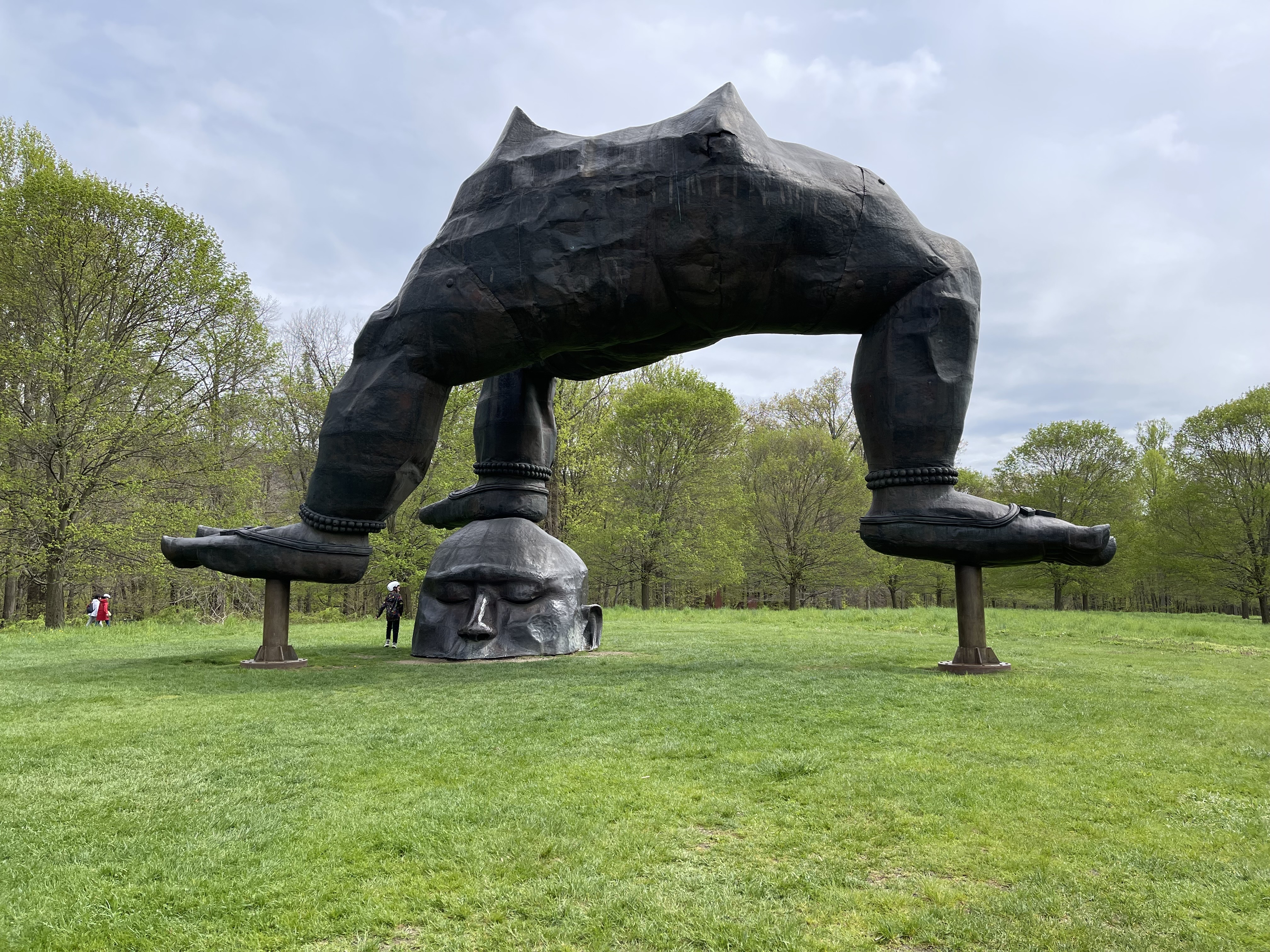 Zhang Huan&amp;rsquo;s &amp;ldquo;Three Legged Buddha&amp;rdquo; 2007, a sculpture with three iron legs on top of a single iron head attached to the earth