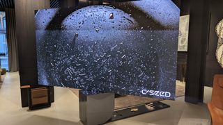 C SEED N1 TV with water splashing on screen