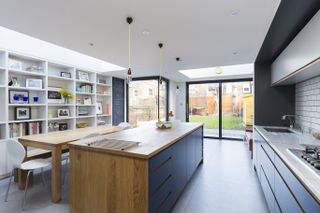 Kitchen extension with blue kitchen, sliding doors and rooflights