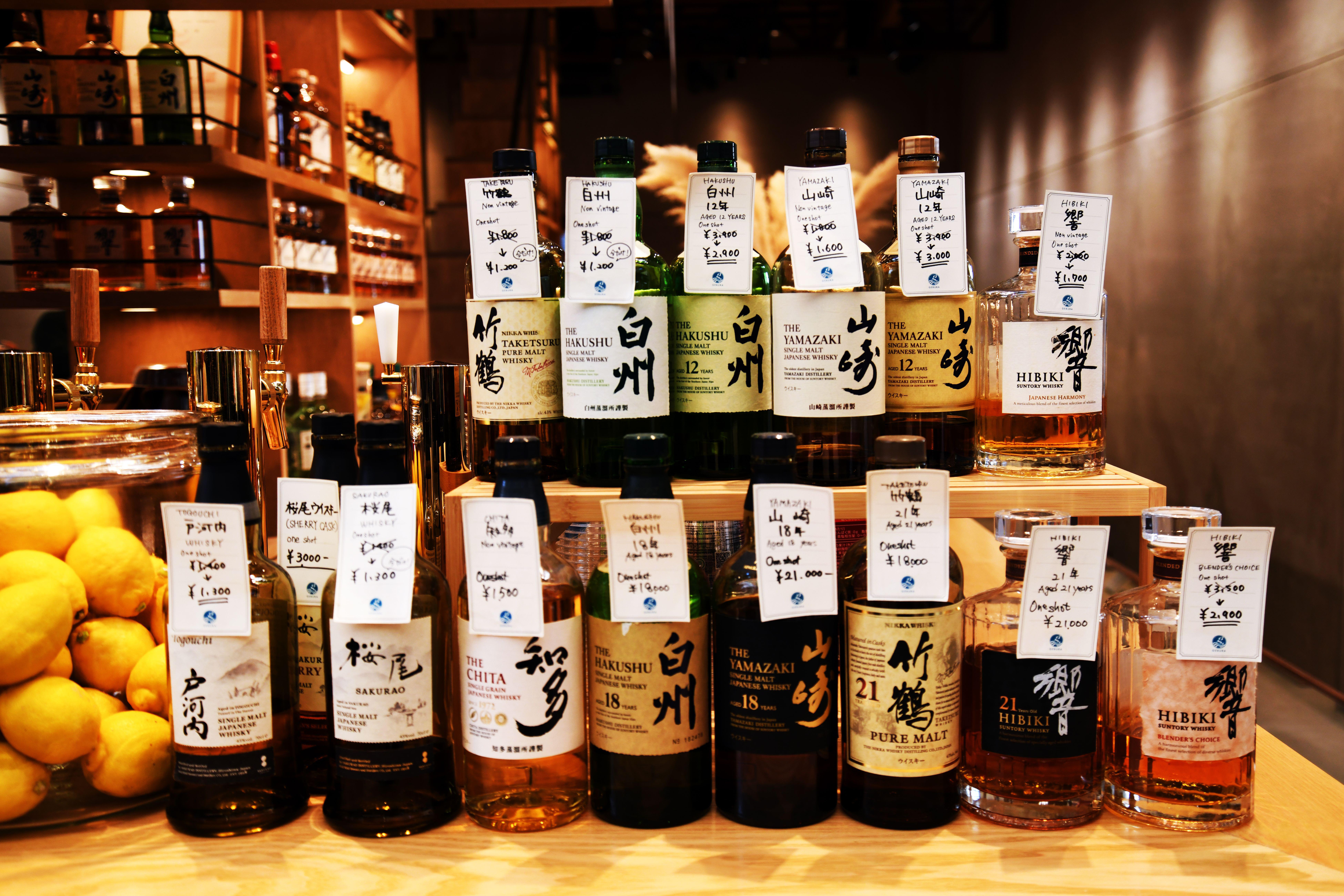 GEBURA SISTER bar in Miyajima, Itsukushima Island, Japan. A row of japanese whiskies are on display