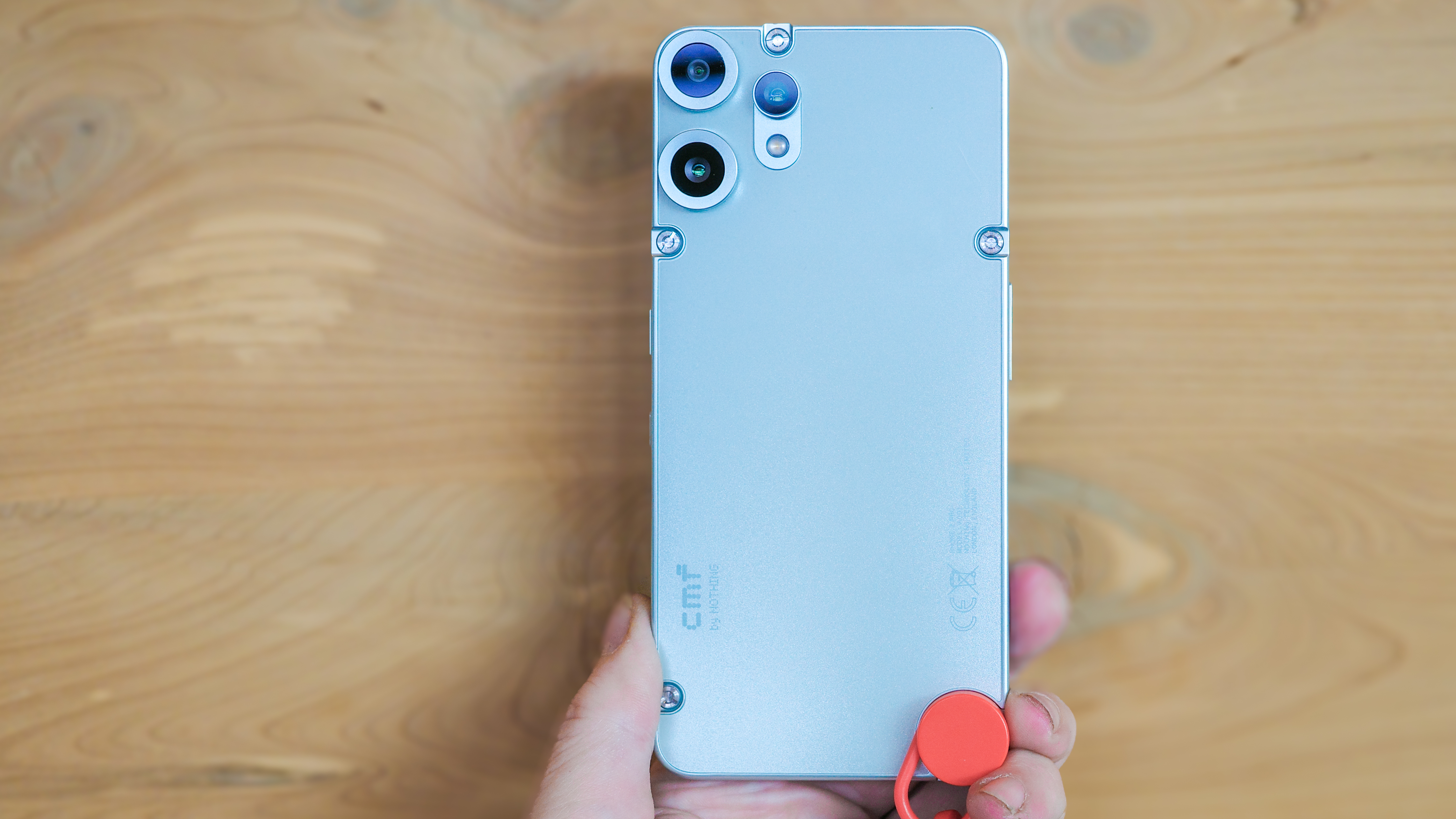 CMF Phone 2 Pro in light green showing back with exposed screws and cameras
