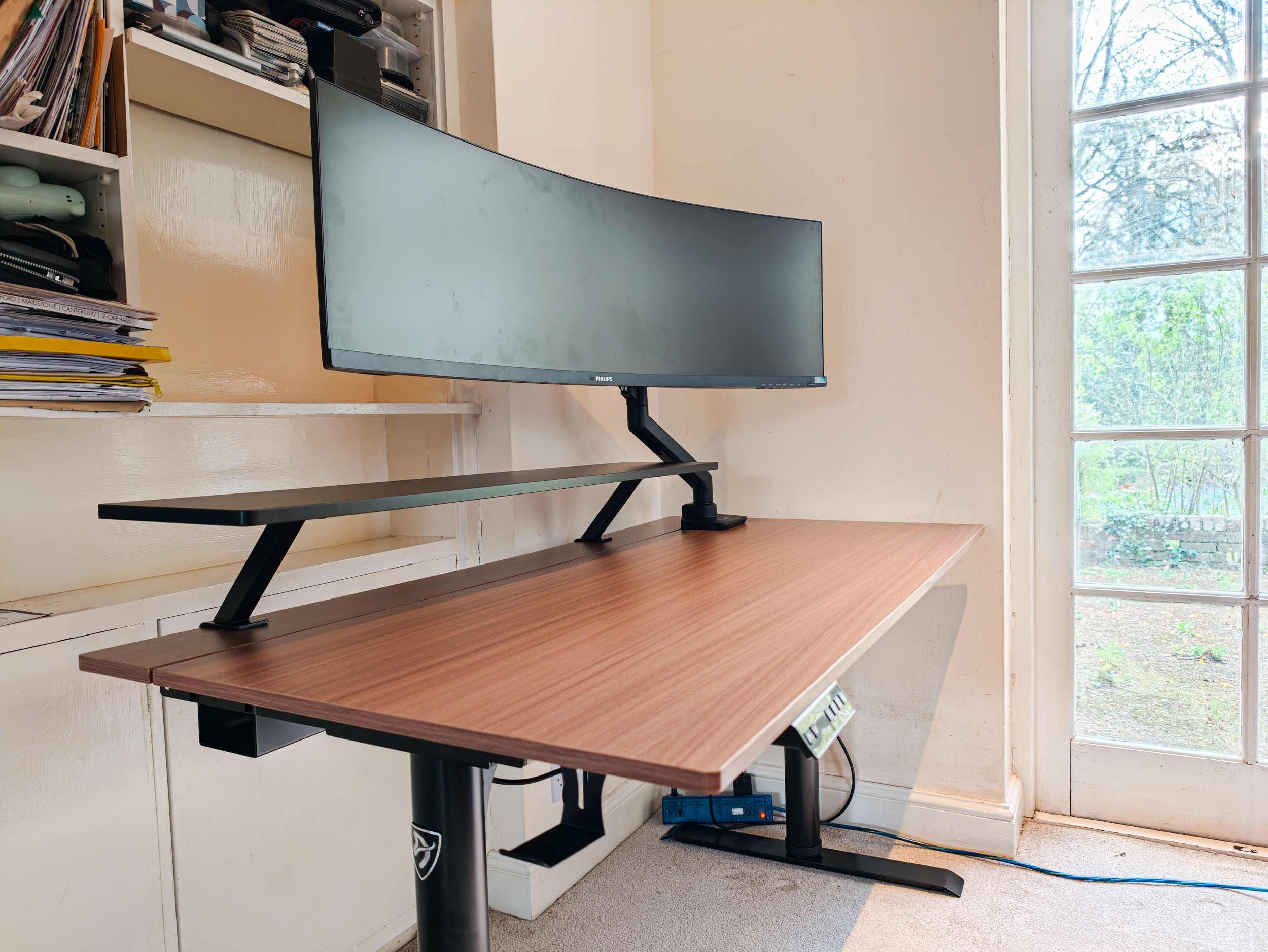 The Arozzi Arena Nordico Electric Standing Desk, freshly assembled, in home office room