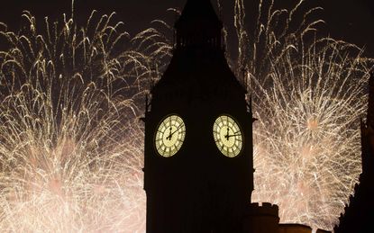 Fireworks behind Big Ben as seen from Parliament Square