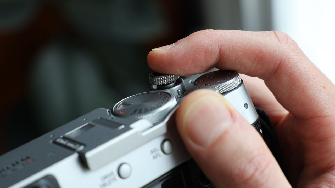 Fujifilm X100VI camera on a wooden table