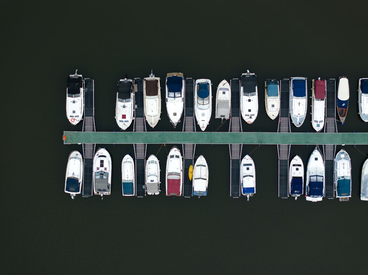 An aerial photo of boats on a river taken with the DJI Mavic 3 Pro's middle camera