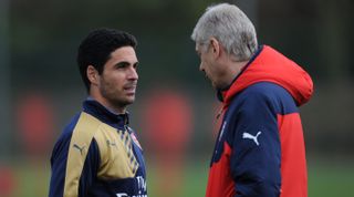 Arsenal's Mikel Arteta and manager Arsene Wenger in conversation during a training session on 8 April, 2016 in London Colney, United Kingdom