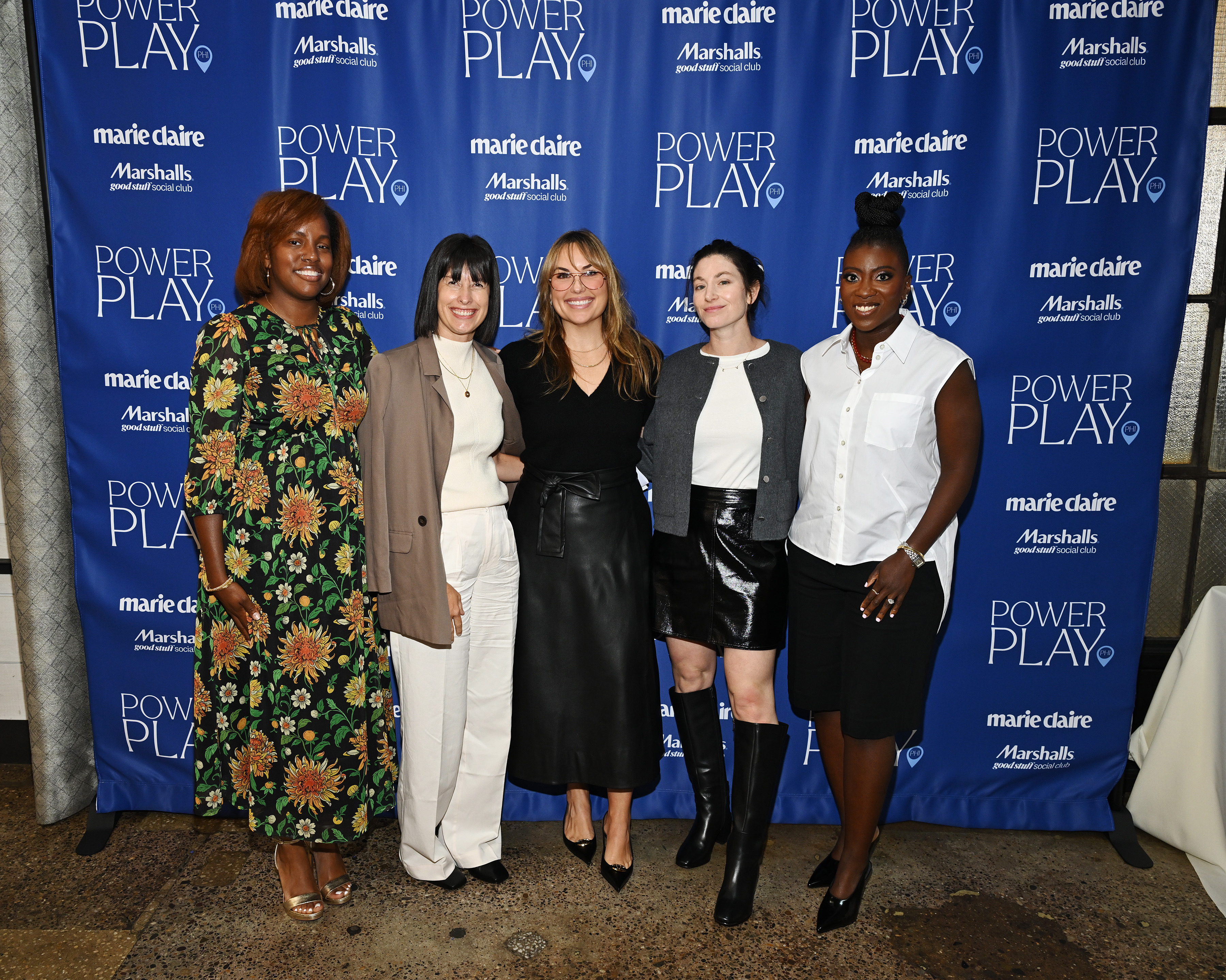 Five women pose together in front of the Marie Claire Power Play step-and-repeat backdrop during the summit.