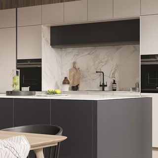 black and white kitchen with marble back splash and built-in hob