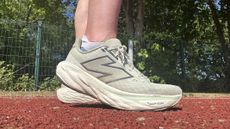 New Balance 1080 v14 running shoes being tested on the track by our reviewer