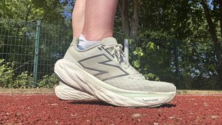 New Balance 1080 v14 running shoes being tested on the track by our reviewer