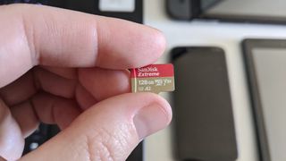 Hand holding a microSD card