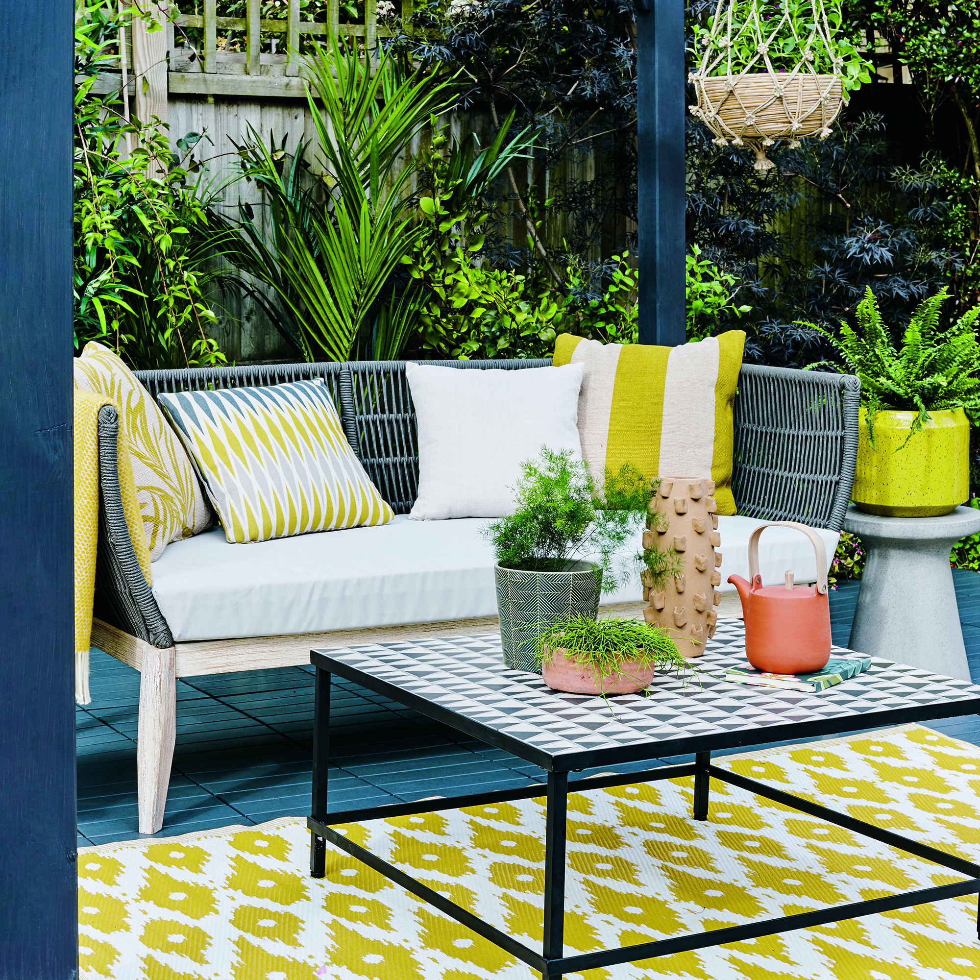 balcony with printed yellow rug on floor
