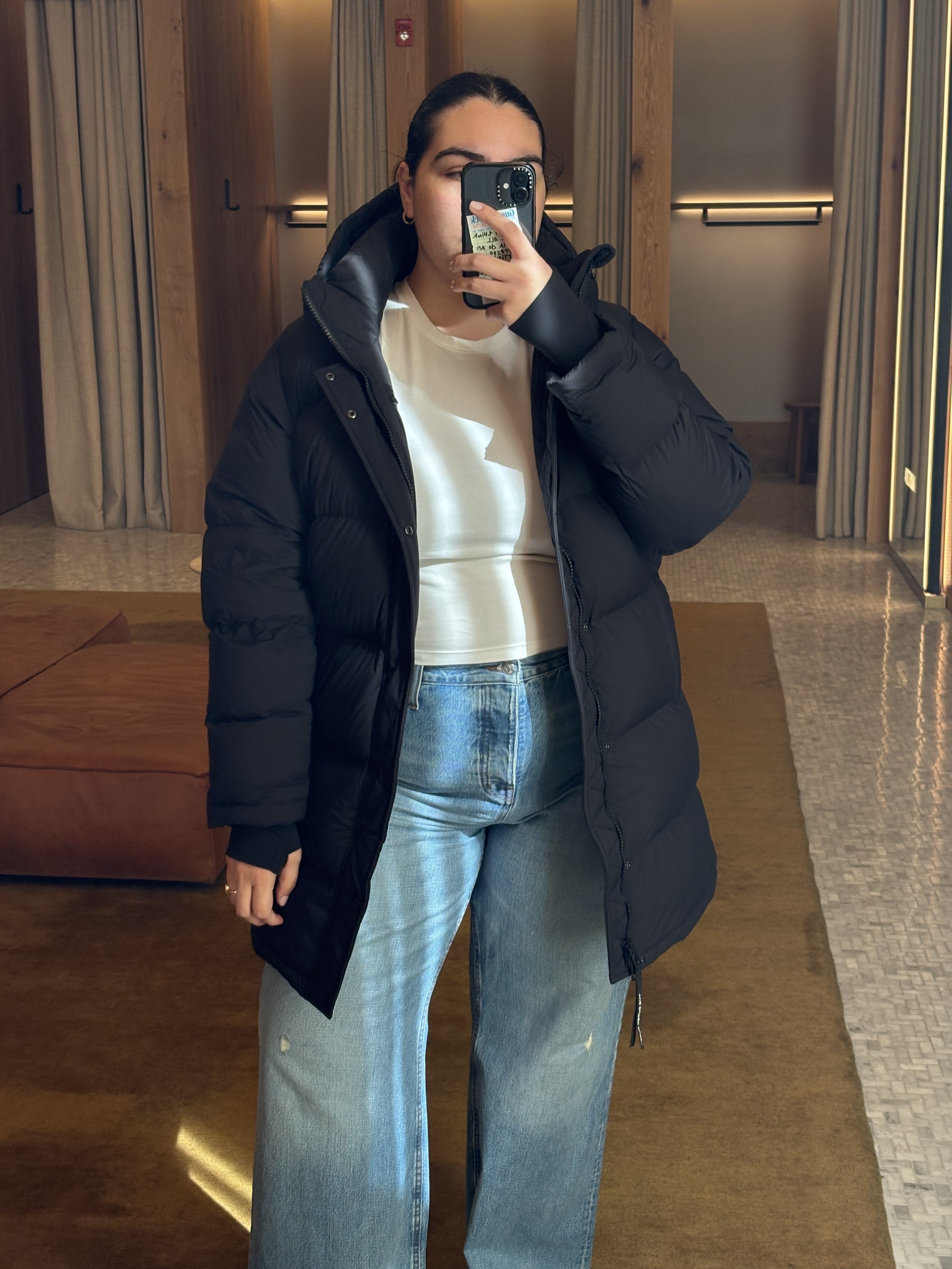 Who What Wear editors reviewing the Aritzia Super Puff.