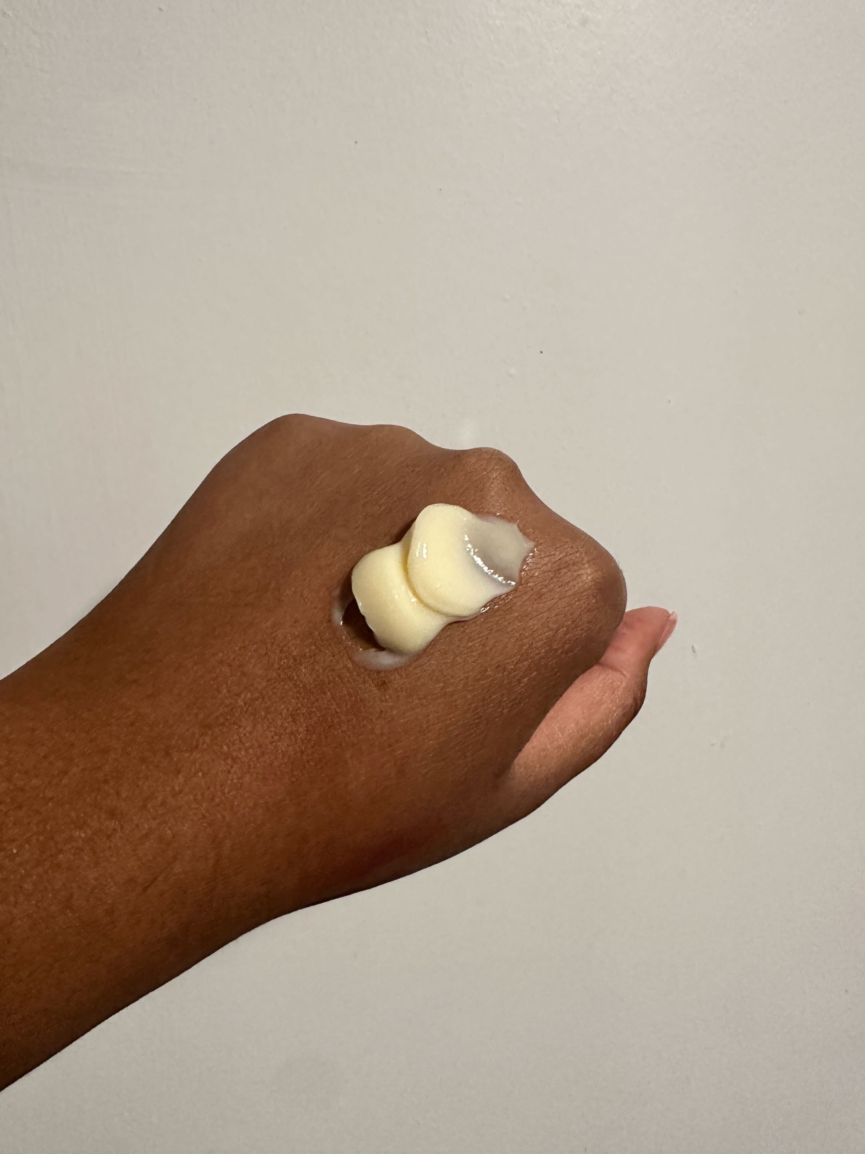 Ariel Baker testing the Oribe Hair Priming Lotion Leave-In Conditioning Detangler.