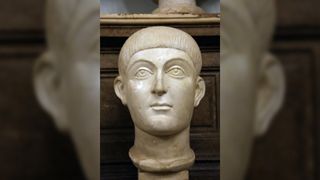 A bust of the western Roman emperor, Honorius (A.D. 384-423). He has large eyes, a small mouth, and a short bowl haircut.