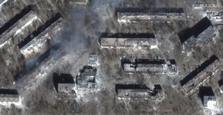 This photo, captured by Maxar Technologies’ WorldView-3 satellite on March 29, 2022, shows the destruction of residential apartment buildings in the Ukrainian city of Mariupol by Russian shelling.