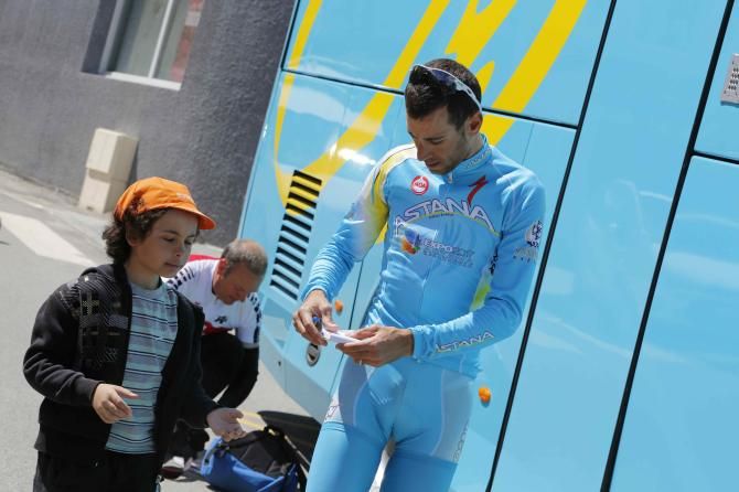 Nibali signs an autograph for a young fan during the rest day