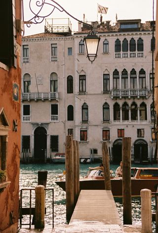 Venetian buildings and private water taxi