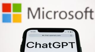 ChatGPT website and Microsoft logo displayed on a screen