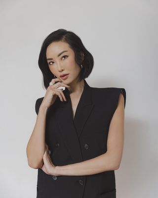 Photo of Chriselle Lim against white background in black structured vest.