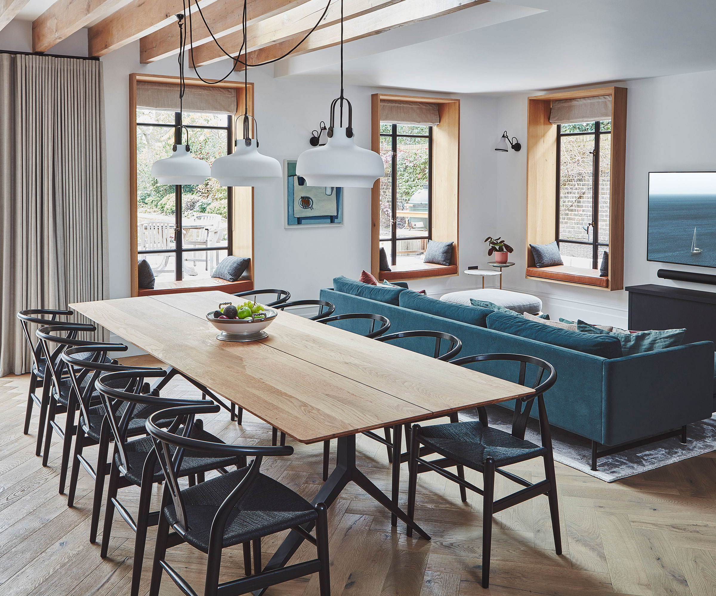 modern open plan dining room living room with rope pendant lighting