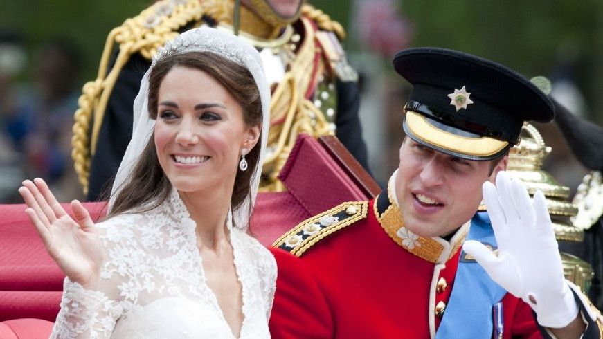 Kate and WIlliam wave to the crowd on their wedding day.