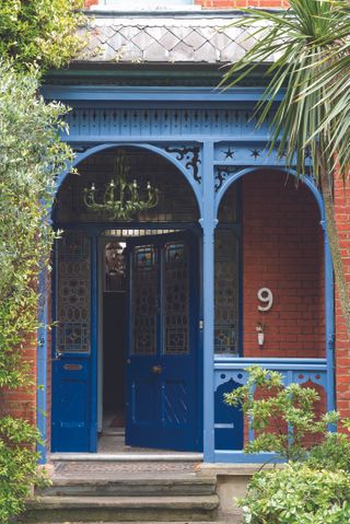 blue front door with painted porch