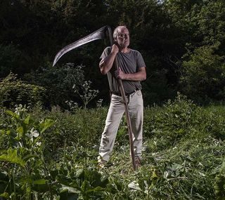 Scyther Nigel Adams in the churchyard at Pyrton Church, Oxfordshire. Pictures © Richard Cannon/Country Life Picture Library