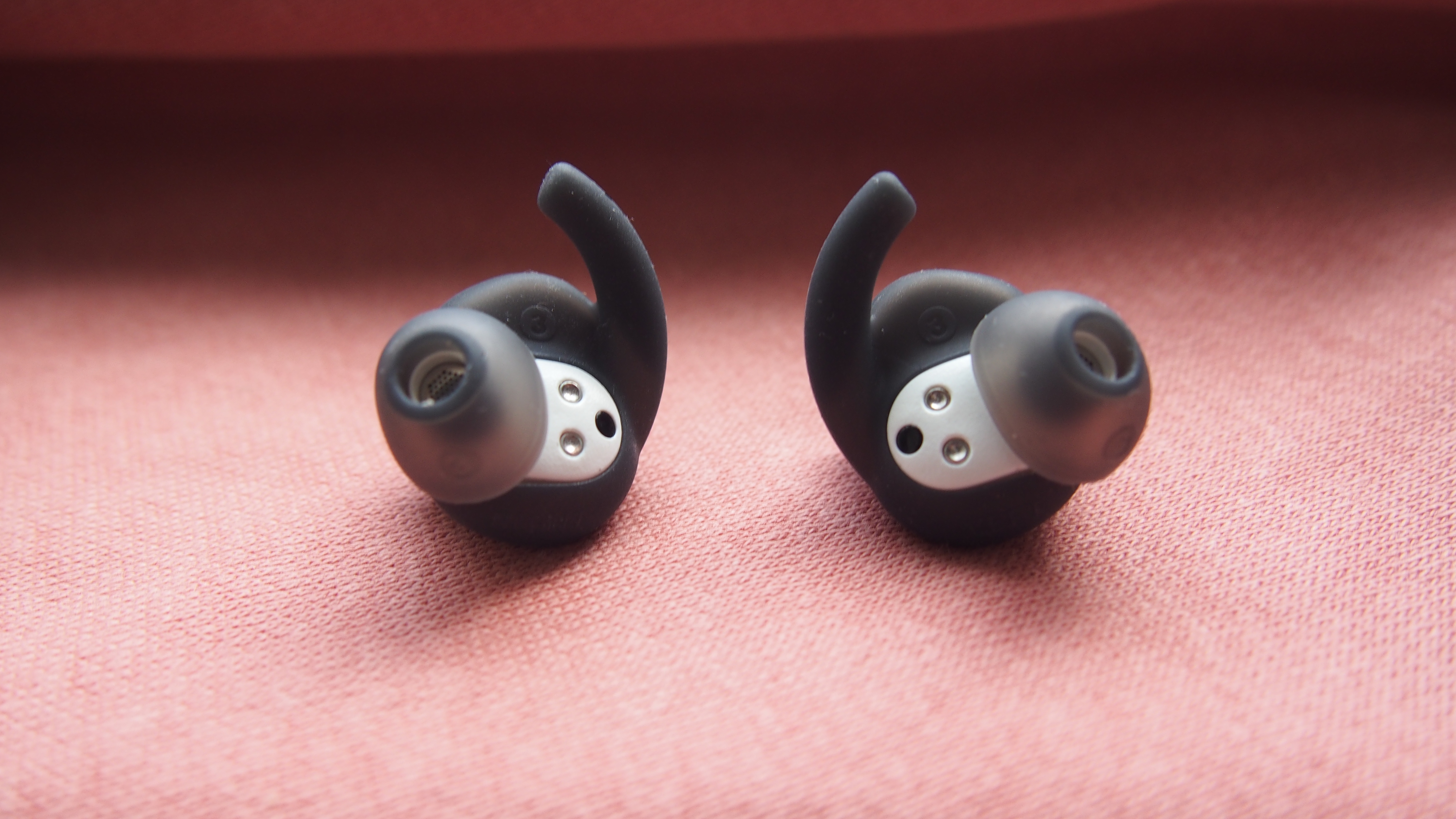 a closeup of the adidas fwd-02 sport earbuds