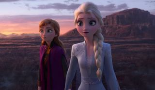 Frozen II Anna and Elsa standing in the wide open canyon