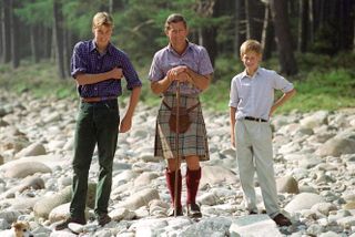 Prince Harry, Prince William and Prince Charles standing together