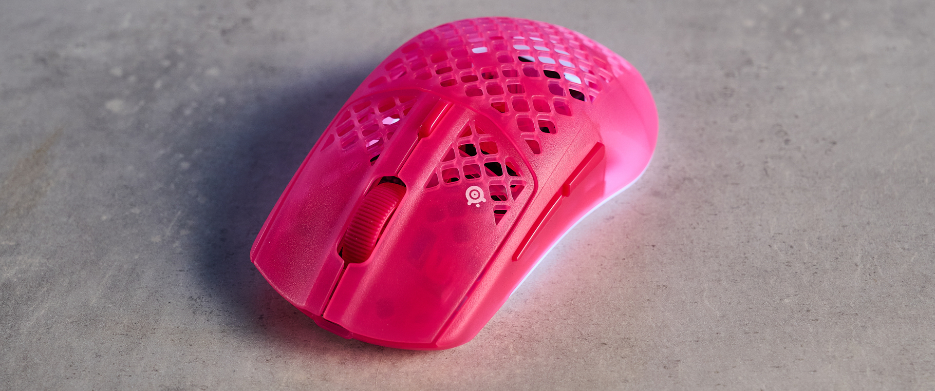 A magenta SteelSeries Aerox 3 Wireless Gen 2 wireless mouse for gaming