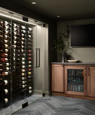 Glass wine cabinet storage next to wooden cupboards