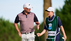 James Morrison and his son walk off the green