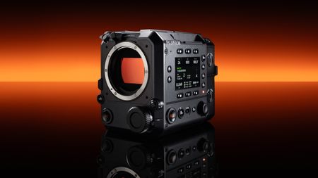 Fujifilm GFX Eterna 55 cinema camera in front of a strip of orange light