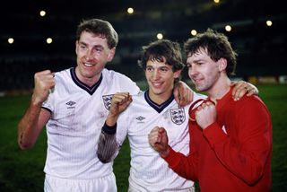 Gary Lineker (centre) celebrates alongside Terry Butcher (left) and Bryan Robson after scoring four goals for England in a 4-2 win over Spain in Madrid in February 1987.
