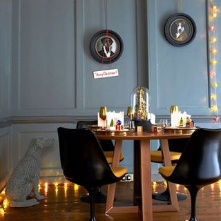 dining room with modern fairy lights and wooden flooring