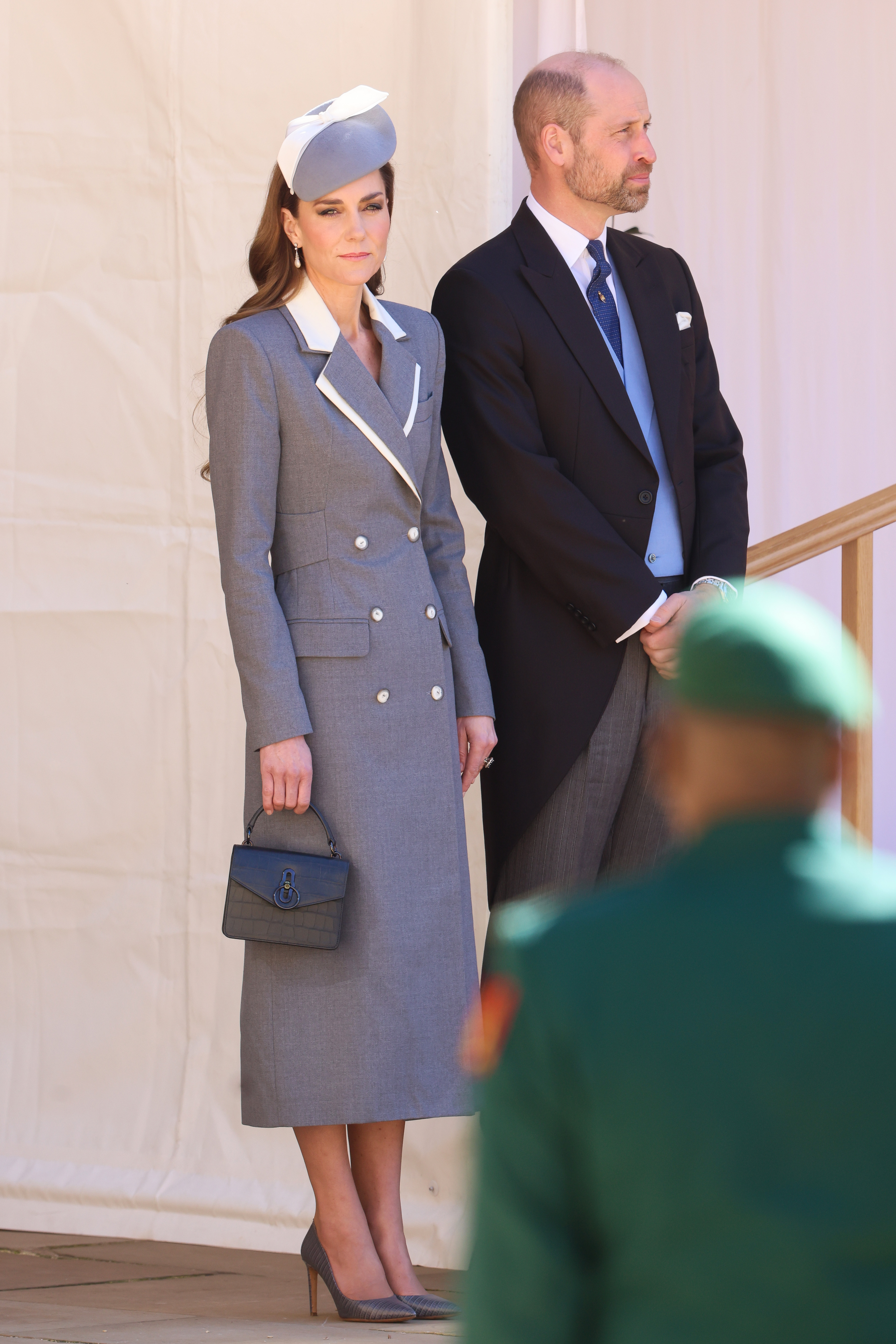 WINDSOR, ENGLAND - MARCH 18: Catherine, Princess of Wales and Prince William, Prince of Wales attend the Quadrangle at the inspection of the Guard of Honour during a ceremonial welcome at Windsor Castle on the first day of State Visit by The President of the Federal Republic of Nigeria on March 18, 2026 in Windsor, England. President Bola Tinubu and First Lady Oluremi Tinubu are conducting a historic State Visit to the United Kingdom, marking the first state visit by a Nigerian leader in 37 years and the first to be hosted at Windsor Castle. (Photo by Chris Jackson/Getty Images)