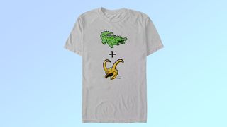 A grey t-shirt with an alligator above a plus sign above Loki's helmet