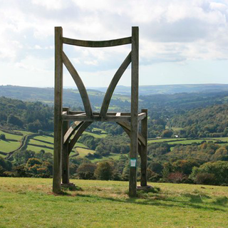 chair sculpture on hill and green scenery