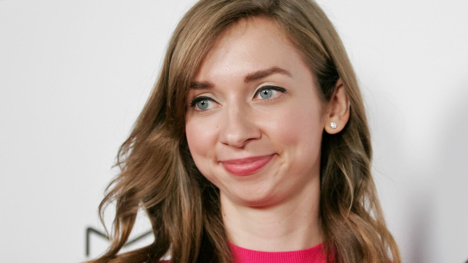 Lauren Lapkus brightens her blue sofa with an unexpected, joyful accessory – and it's hiding on Wayfair for $55